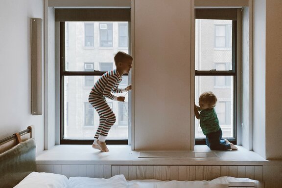 two-kids-playing-beside-glass-windows-3273851.jpg