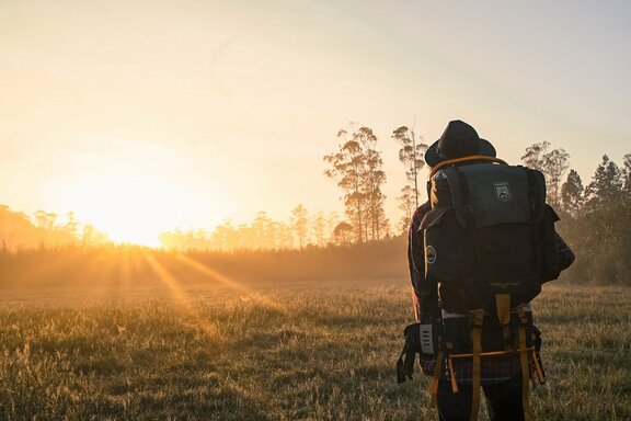 man-in-black-backpack-during-golden-hour-1230302.jpg